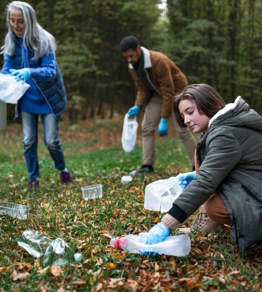 group-of-volunteers-cleaning-up-forest-from-waste-community-service-concept-e1659824078478.jpg