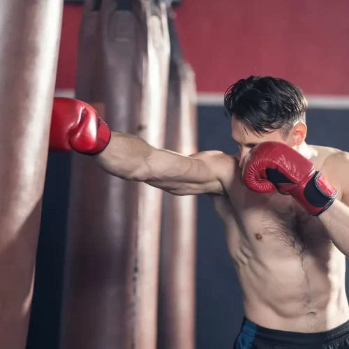 caucasian-bodybuilder-man-shirtless-athlete-wear-boxing-gloves-doing-boxing-workout-exercise